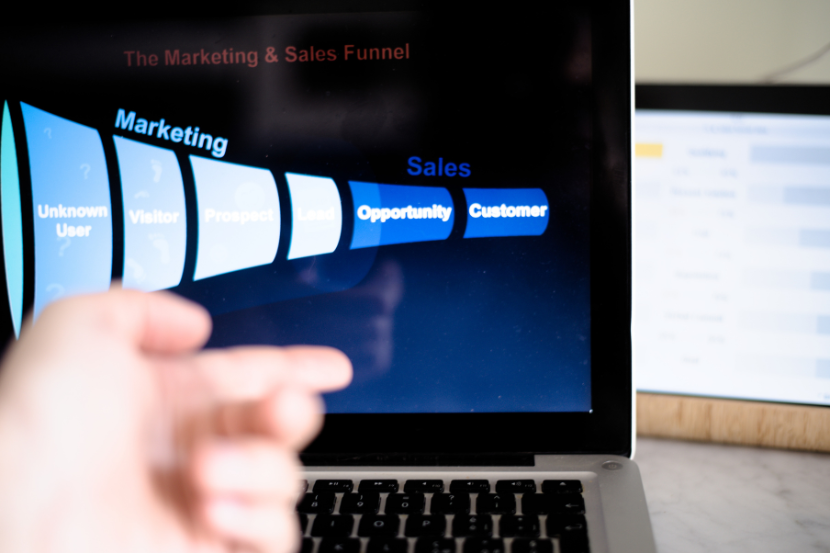 Sales funnel diagram on screen, symbolising limited visibility into pipeline stages.